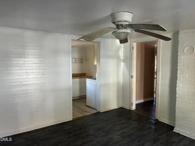 a view of a livingroom with wooden floor