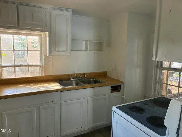 a kitchen with a sink and cabinets