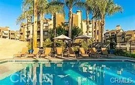 a view of swimming pool with a table and chairs