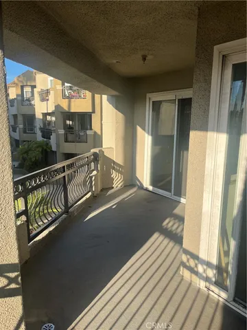 a view of a balcony with wooden floor
