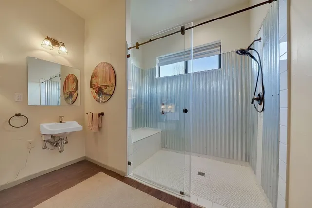 a view of a cafe with a table and chairs in front of building