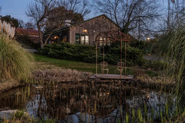 a view of a yard with large trees