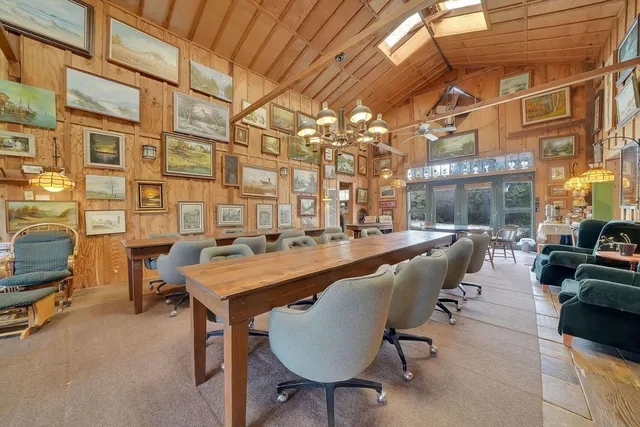 a view of backyard with swimming pool and sitting area