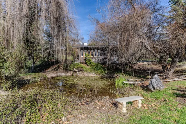 a living room with furniture a couch and a chandelier