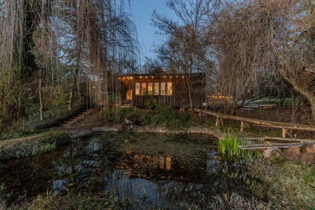 a bedroom with a bed a couch and dresser