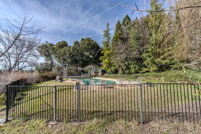 an aerial view of house with yard