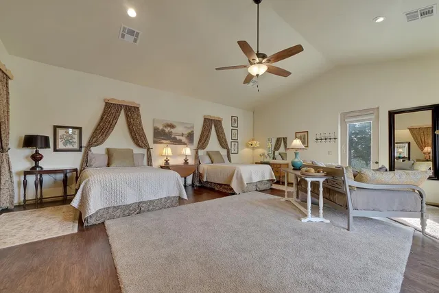 a living room with lots of furniture and a chandelier