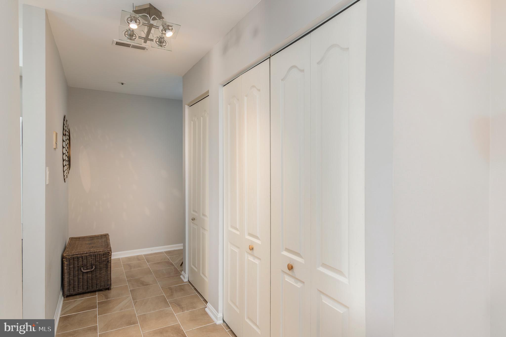 8382 Montgomery Run Road, Unit F Ellicott City, MD 21043 - Photo 2 of 22 Updated tile flooring in entryway w/ double closet
