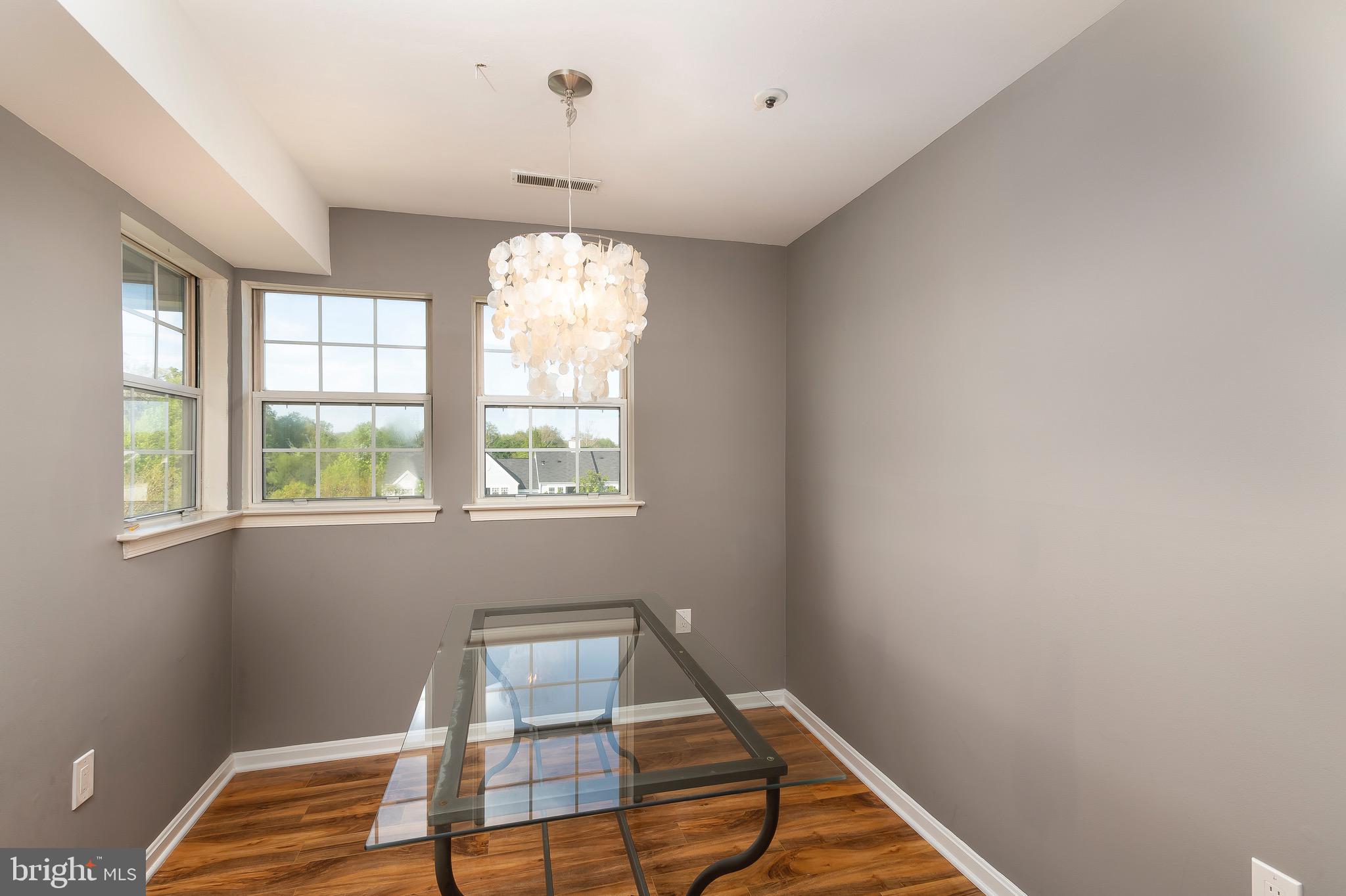 8382 Montgomery Run Road, Unit F Ellicott City, MD 21043 - Photo 6 of 22 Cozy dining room with wood flooring
