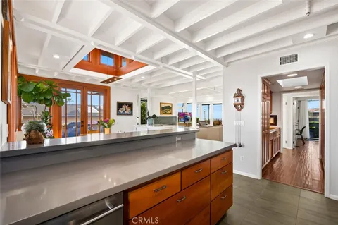 a kitchen view with a sink and microwave