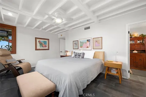 a bathroom with a tub a sink and mirror