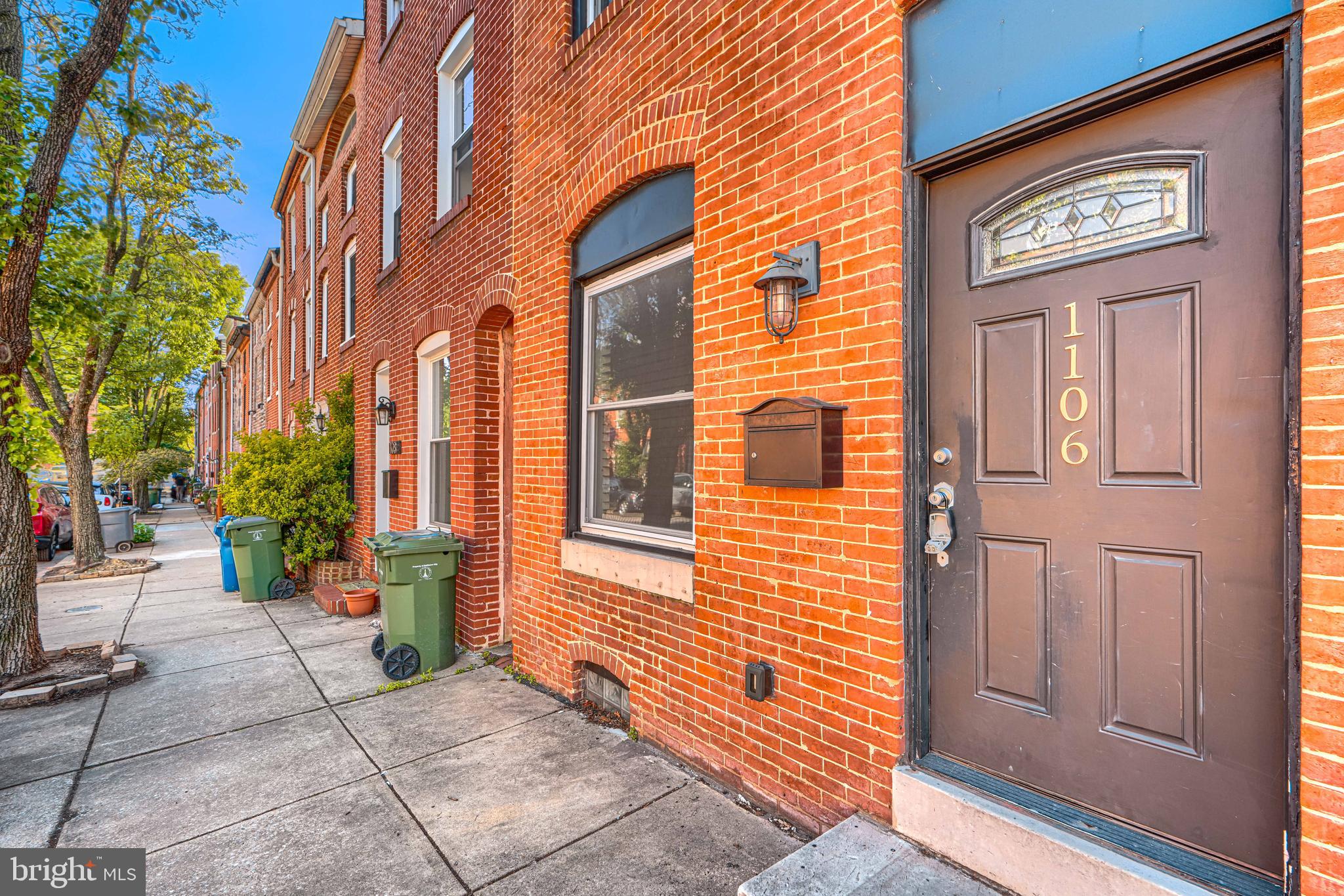 1106 Battery Avenue Baltimore, MD 21230 - Photo 2 of 36 a view of a brick house with many windows