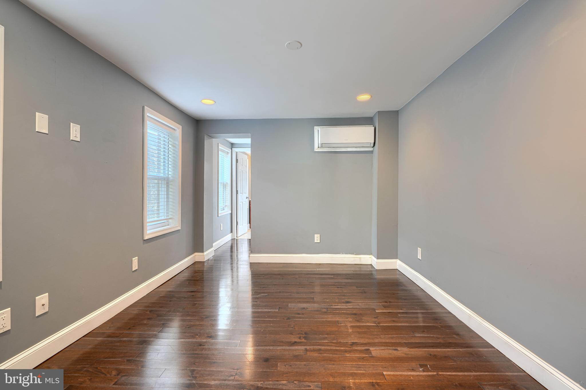 1106 Battery Avenue Baltimore, MD 21230 - Photo 21 of 36 a view of an empty room with window and wooden floor