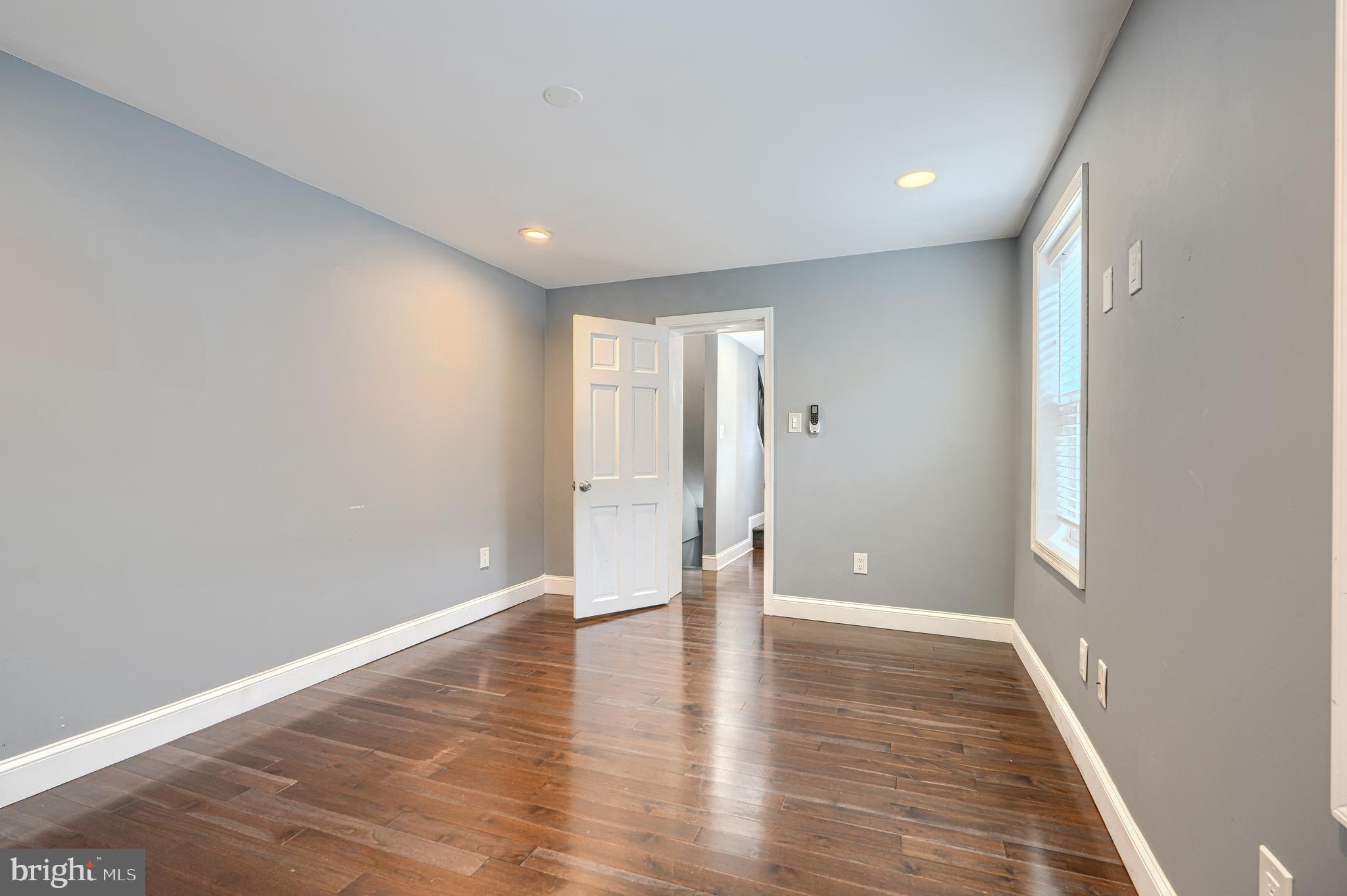 1106 Battery Avenue Baltimore, MD 21230 - Photo 22 of 36 a view of an empty room with wooden floor