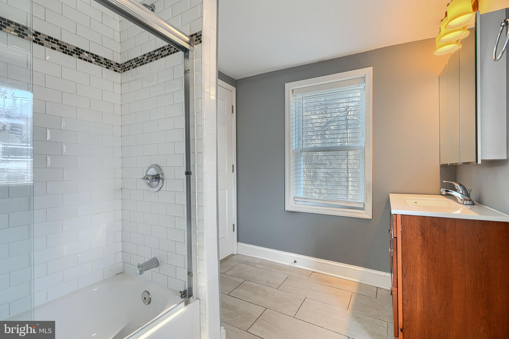 1106 Battery Avenue Baltimore, MD 21230 - Photo 24 of 36 a bathroom with a bathtub and a shower