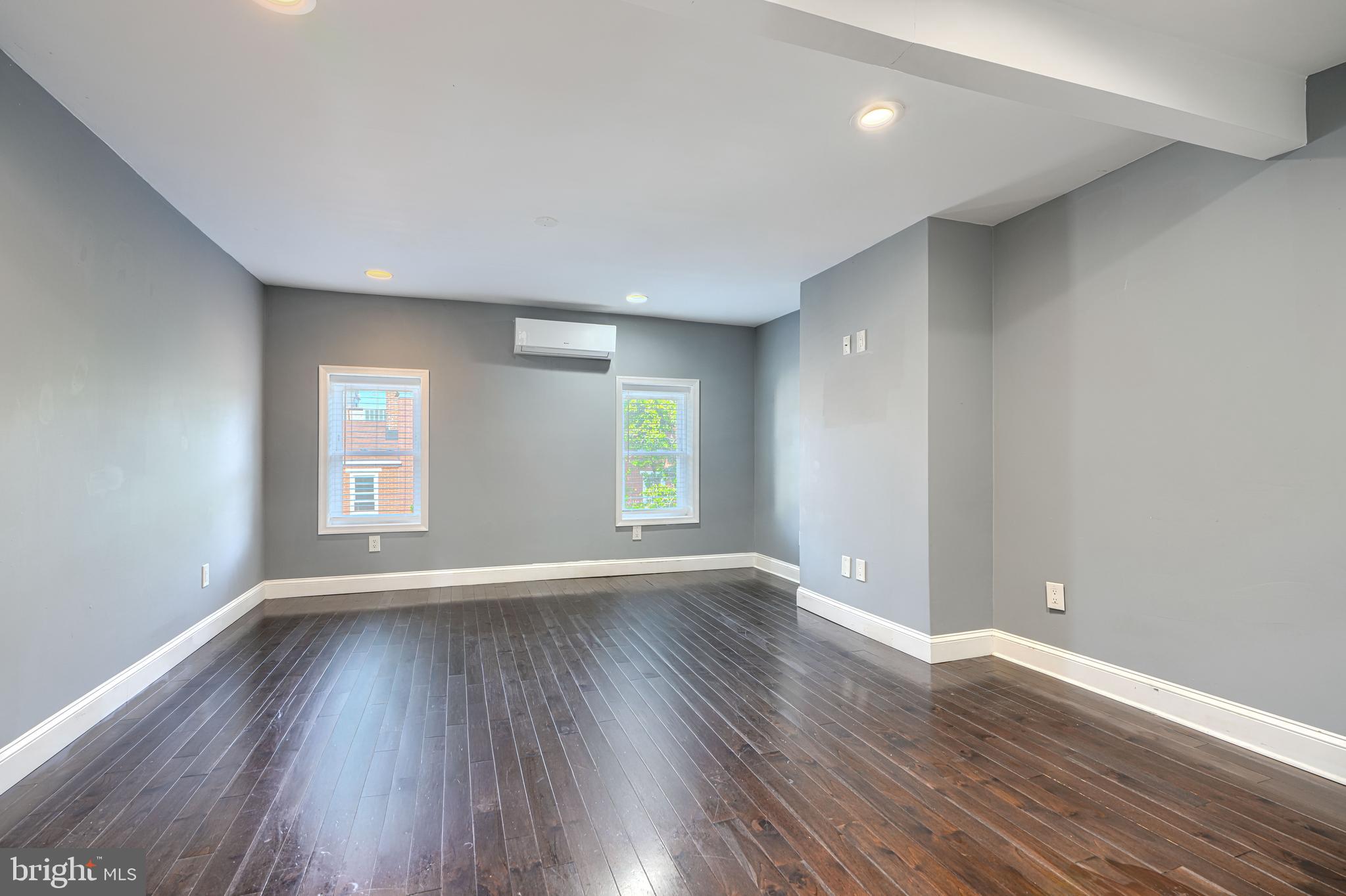 1106 Battery Avenue Baltimore, MD 21230 - Photo 30 of 36 a view of an empty room with wooden floor and window