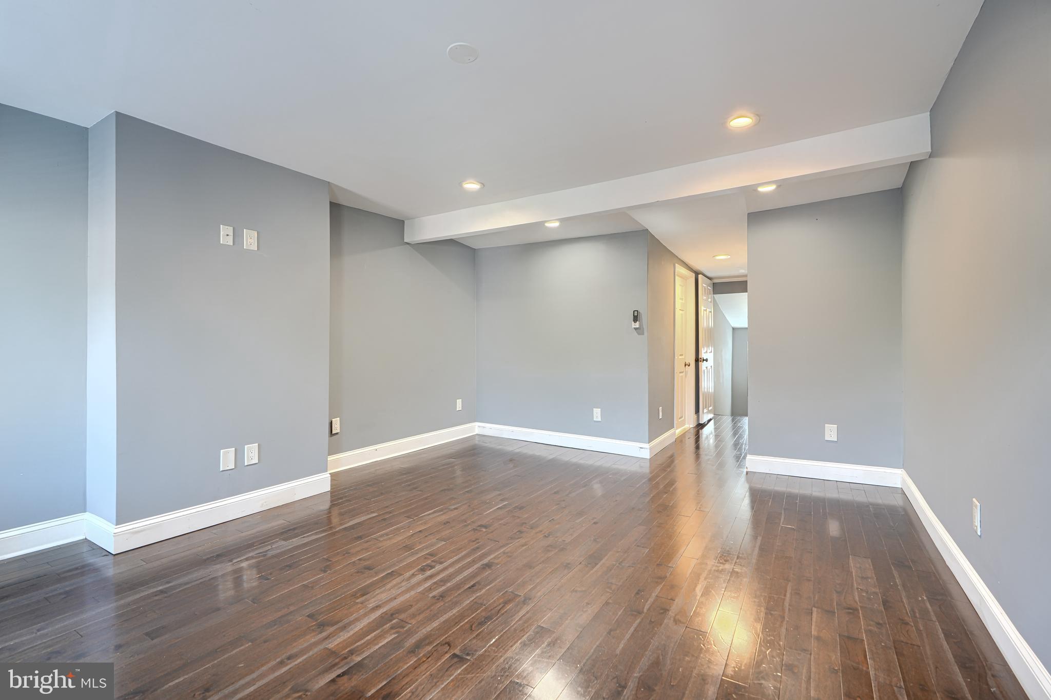 1106 Battery Avenue Baltimore, MD 21230 - Photo 31 of 36 a view of an empty room with wooden floor