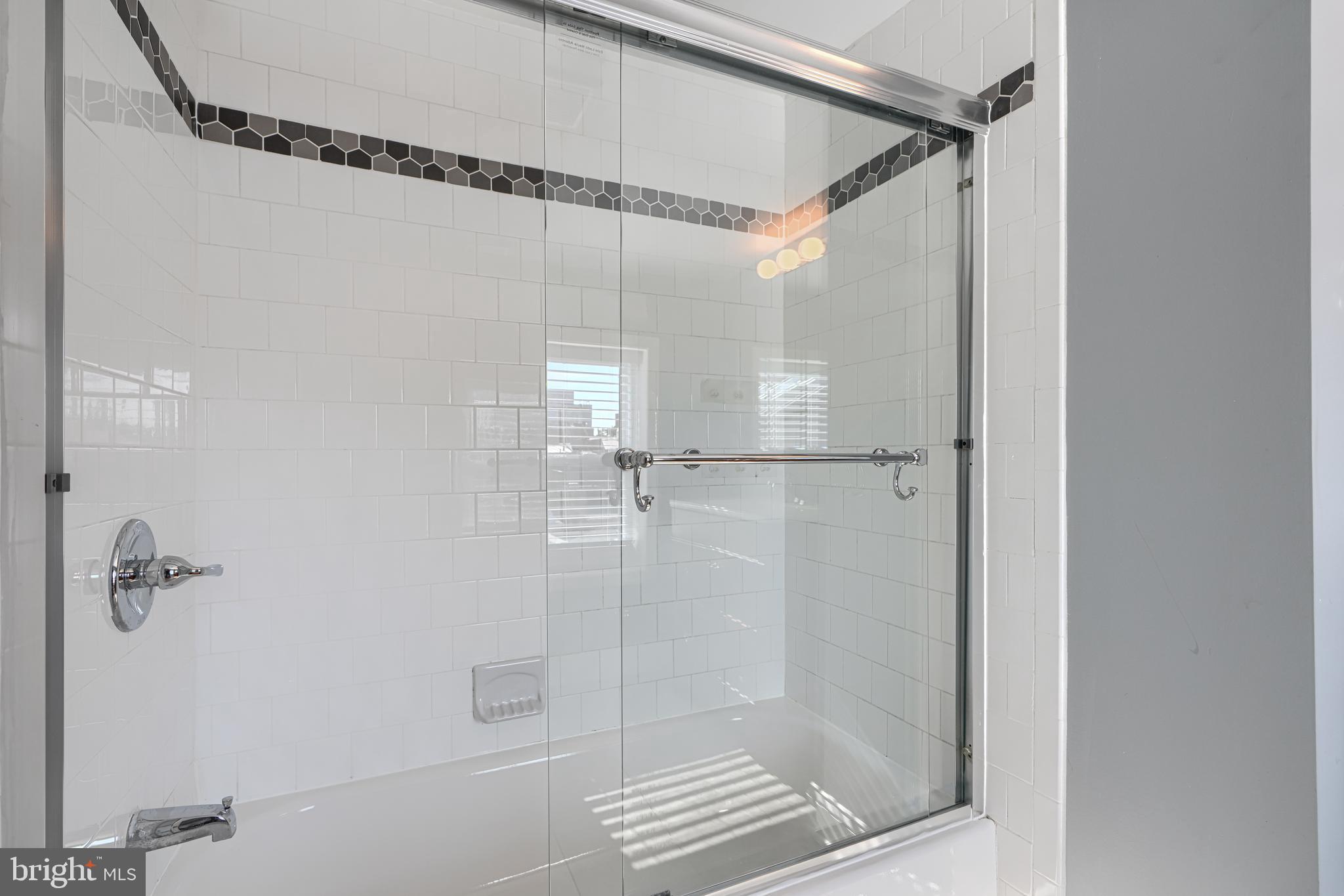 1106 Battery Avenue Baltimore, MD 21230 - Photo 33 of 36 a bathroom with a glass door shower