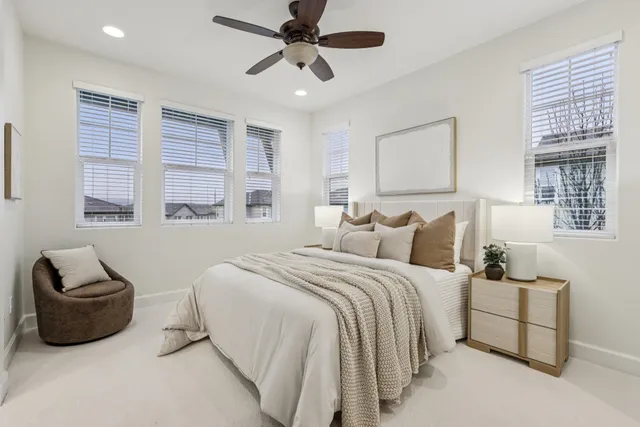 a bedroom with bed and window