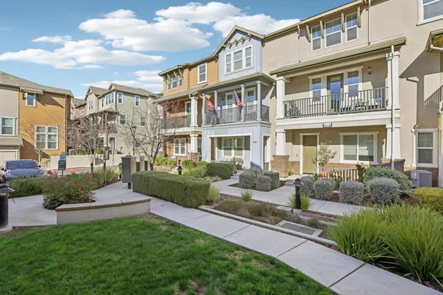 a front view of a building with garden