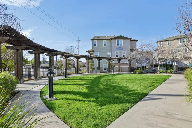 a front view of a house with a yard table and chairs