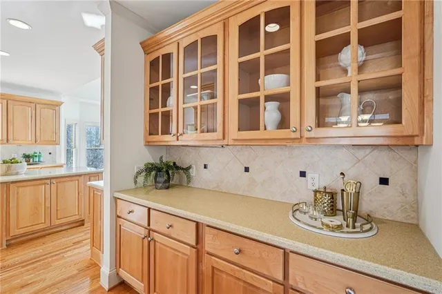 a kitchen with a sink and cabinets