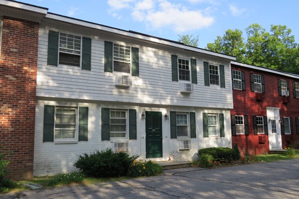 31 Liberty Square Road, Unit D Boxborough, MA 01719 - Photo 1 of 9 a front view of brick house with a yard