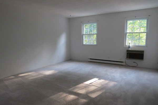 31 Liberty Square Road, Unit D Boxborough, MA 01719 - Photo 4 of 9 an empty room with windows