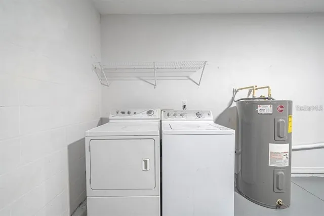 a utility room with dryer and washer