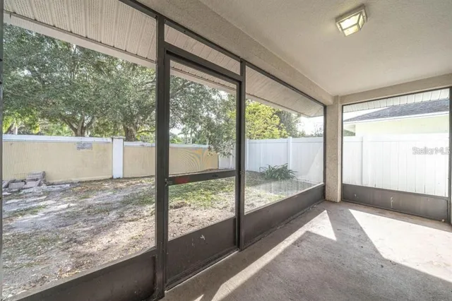a view of a room with large windows