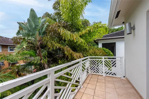 a view of stairs and potted plants