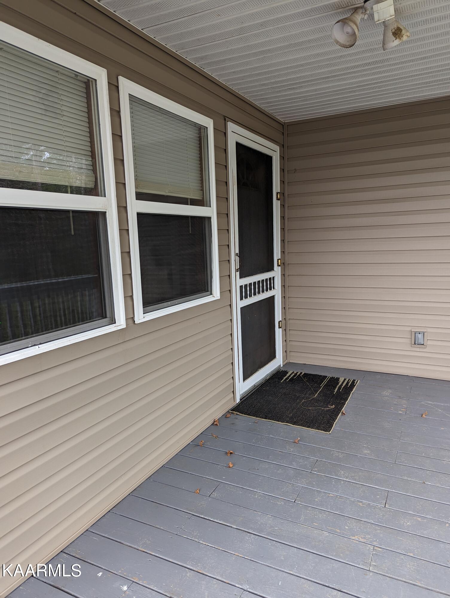 218 Price Road Lancing, TN 37770 - Photo 21 of 22 Covered Porch