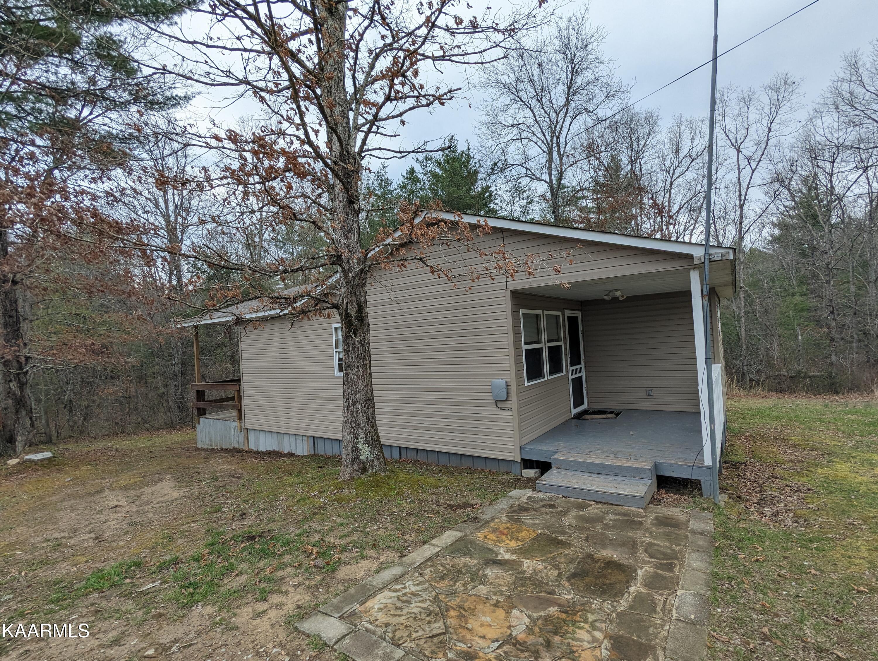 218 Price Road Lancing, TN 37770 - Photo 3 of 22 Covered Porch