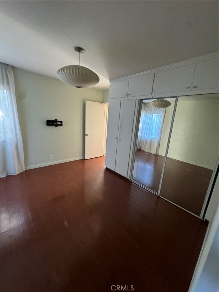 285 Garfield Avenue, Unit 3B Pasadena, CA 91101 - Photo 5 of 8 a view of a hallway with a chandelier