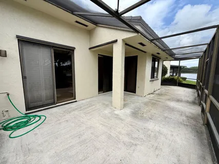 a view of a hallway with wooden walls