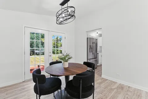 a view of a dining room with furniture window and outside view