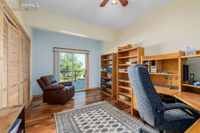 a view of a livingroom with furniture and a window