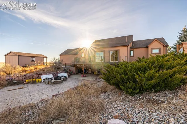 a row of car parked in front of a house
