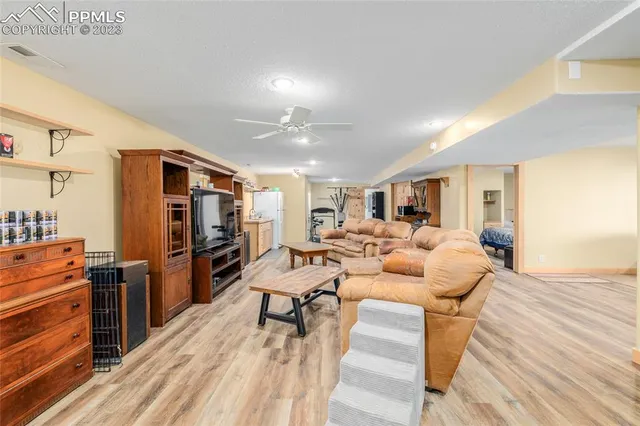 a kitchen with a refrigerator and a stove