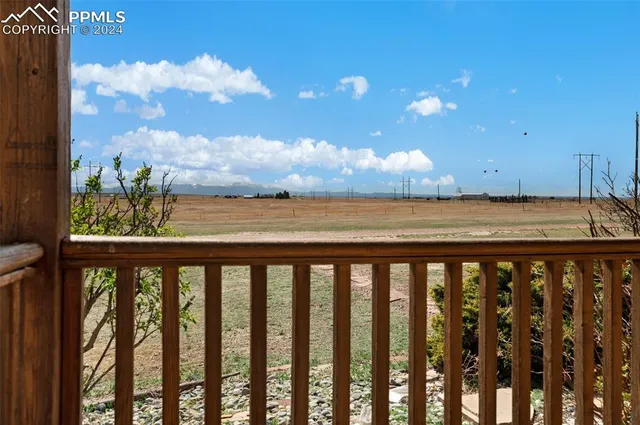 a view of outdoor space with wooden deck