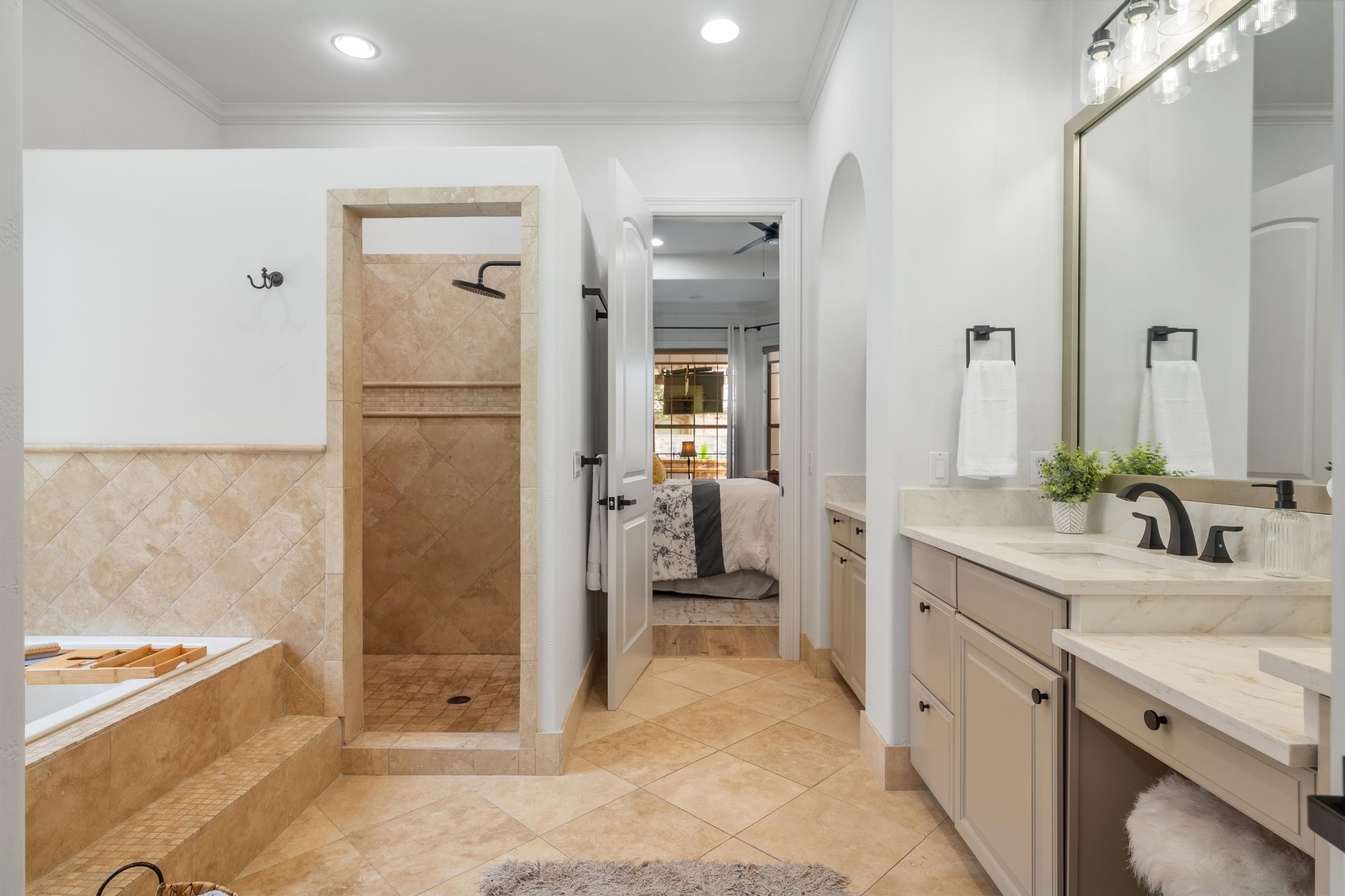 7 Sunview Road The Hills, TX 78738 - Photo 14 of 40 a bathroom with a tub sink and mirror