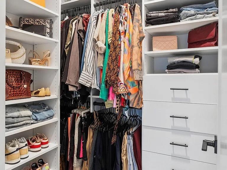 1905 Galt Cmns Kennesaw, GA 30144 - Photo 16 of 28 a view of walk in closet with clothes and shoes