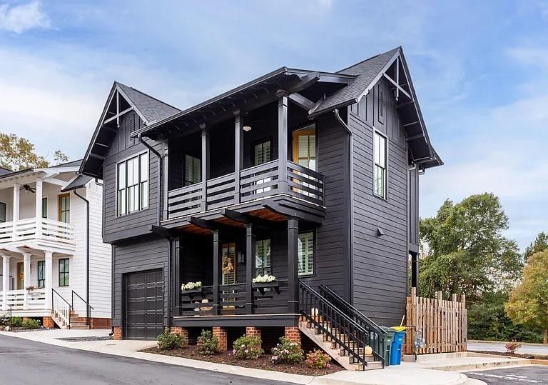 1905 Galt Cmns Kennesaw, GA 30144 - Photo 2 of 28 a front view of a house with garage