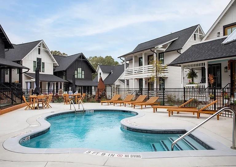 1905 Galt Cmns Kennesaw, GA 30144 - Photo 24 of 28 a front view of a house with swimming pool