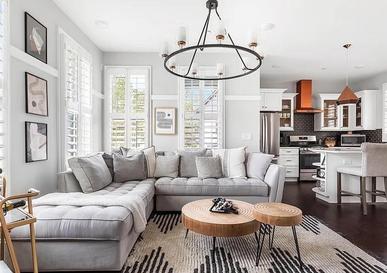 1905 Galt Cmns Kennesaw, GA 30144 - Photo 3 of 28 a living room with furniture a dining table and a chandelier