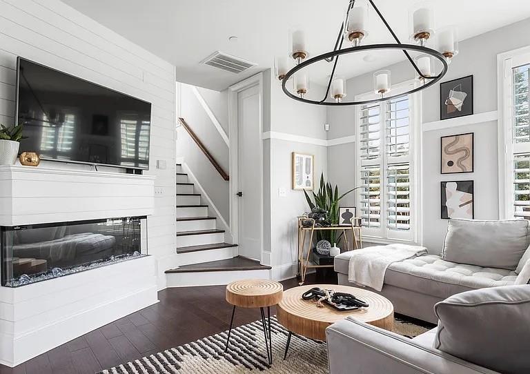 1905 Galt Cmns Kennesaw, GA 30144 - Photo 9 of 28 a living room with furniture a flat screen tv and a fireplace