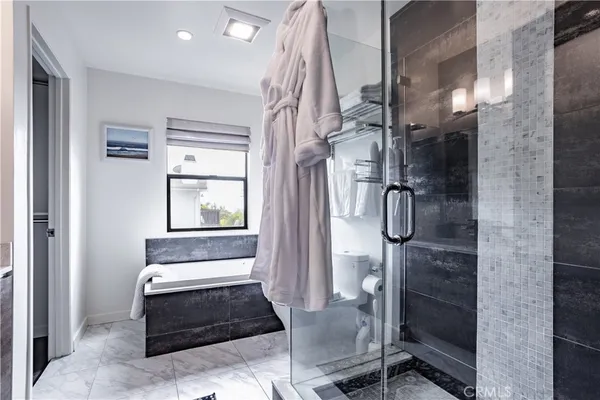 a bathroom with a bathtub and shower