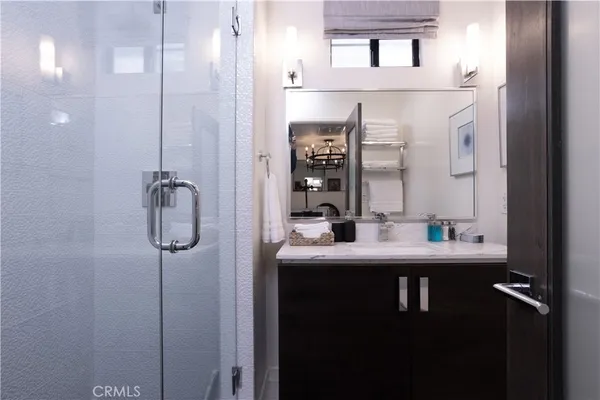 a bathroom with a sink and mirror