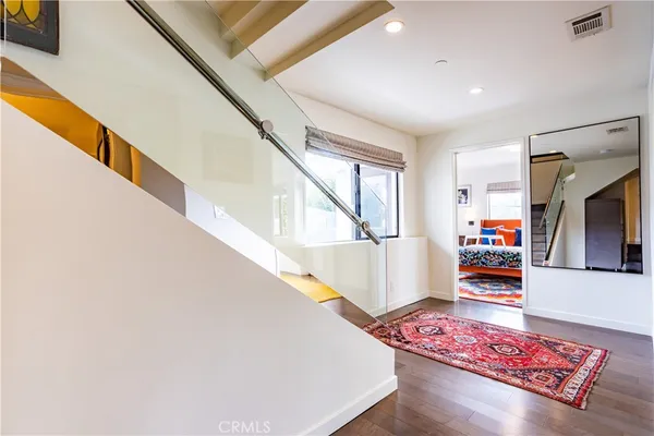 a living room with furniture and a book shelf