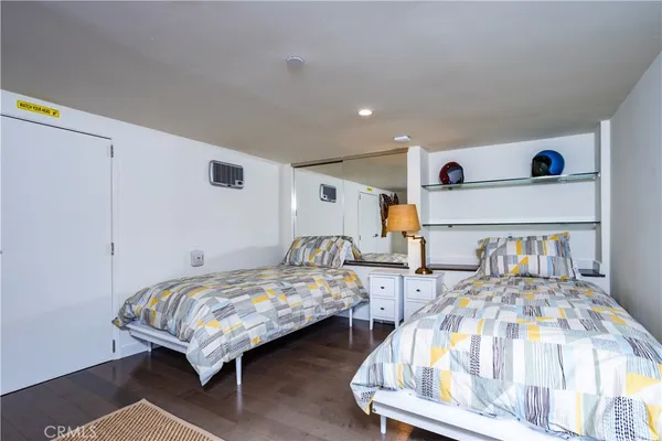 a bedroom with two beds and a table
